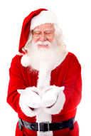 Santa Claus holding something in his hands - isolated over a white background